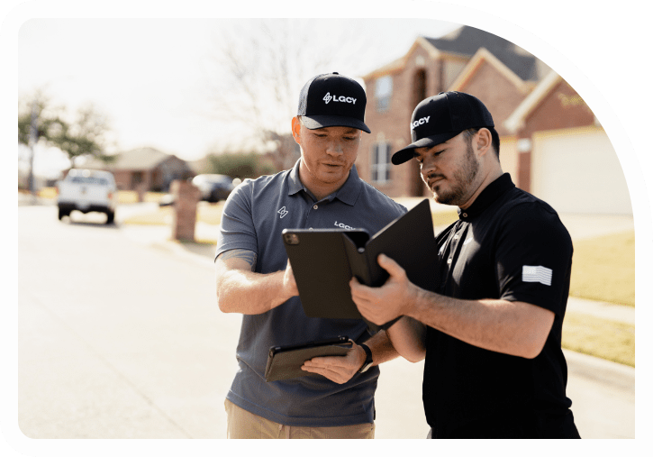 7d1120cefa6bc1194b812220c3a318bd-min Two LGCY Power solar sale reps conversing with tablets