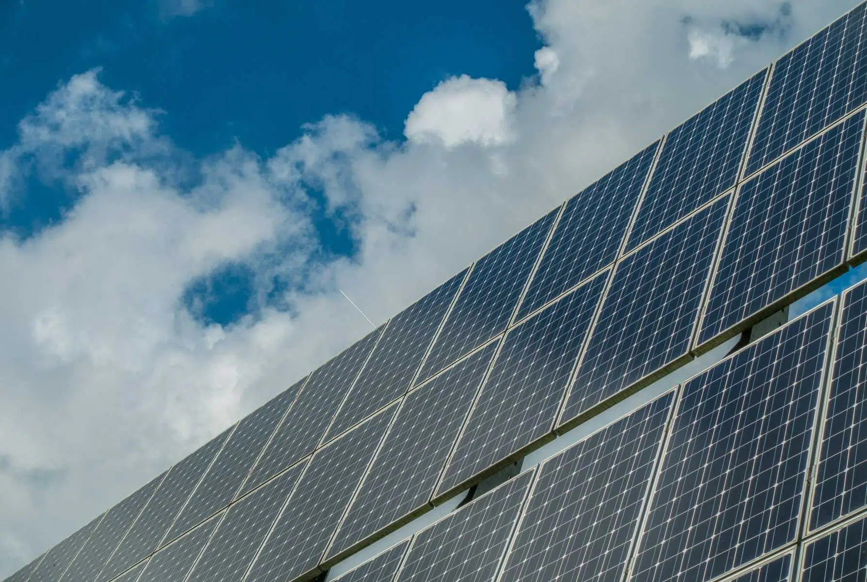 Ground up photo os solar panels on a cloudy day